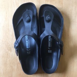 Black Birkenstock rubber slip ons